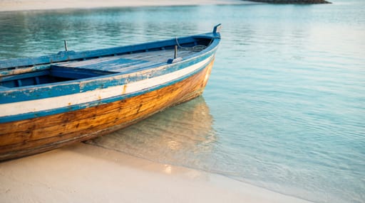 Vibrant Boat on White Sand